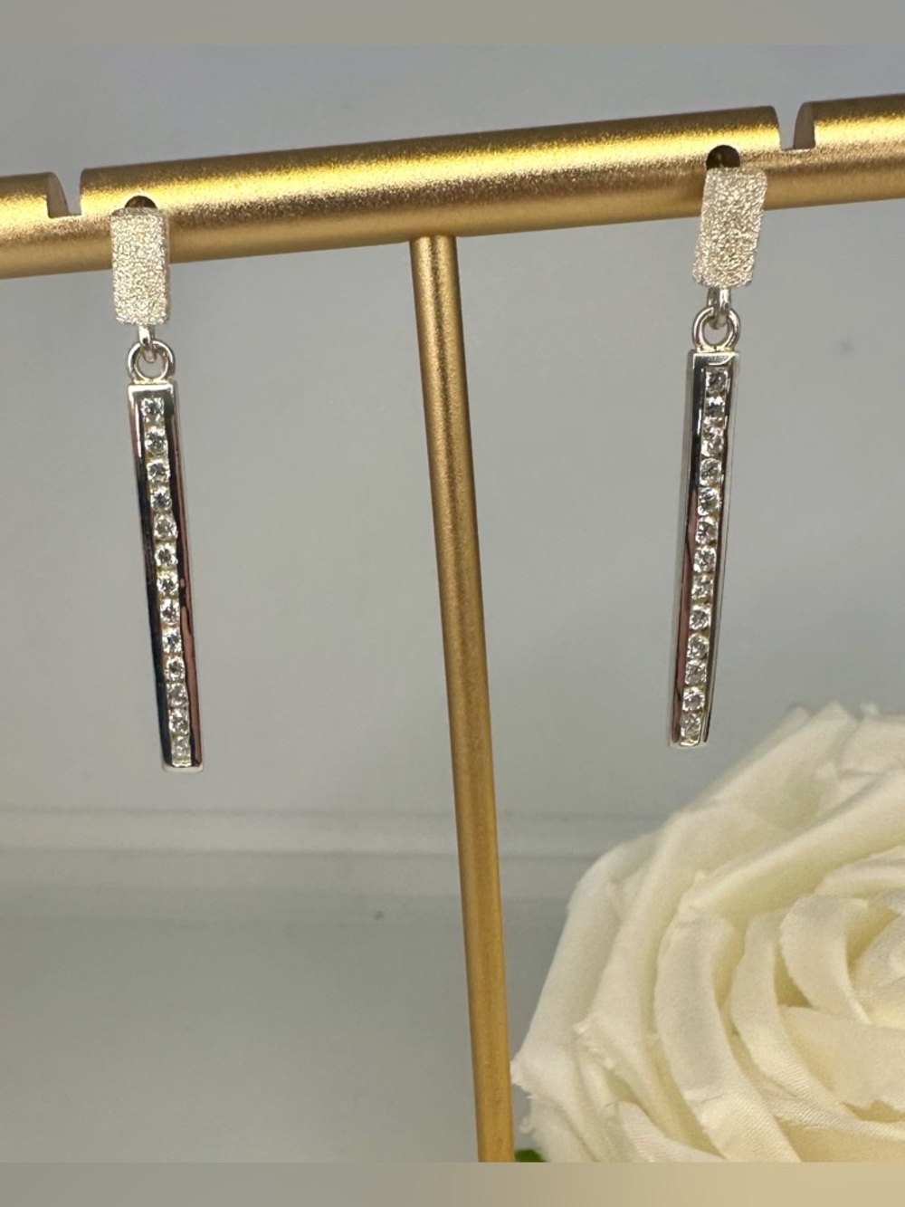 Sterling Silver Stamped Sparkling Dangle Earrings with white stones